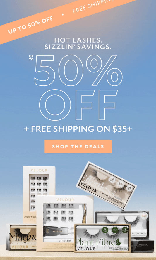 Model applying lashes with gold applicator. Text reads: 'HOT LASHES. SIZZLIN’ SAVINGS. UP TO 50% OFF + FREE SHIPPING ON $35+.' Diagonal banner at top says 'FREE SHIPPING • UP TO 50% OFF.' Button text: 'SHOP THE DEALS.' Gradient blue to peach background.