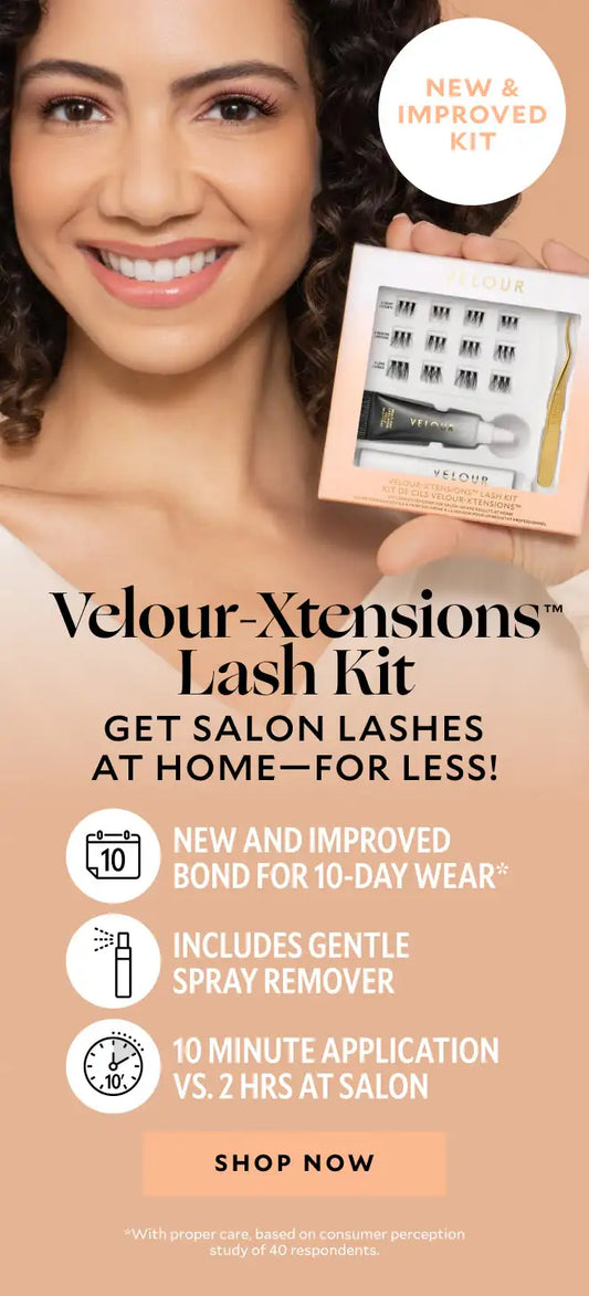 Smiling woman with curly hair holding a boxed Velour-Xtensions Lash Kit. The packaging displays lashes, a bonding adhesive, and applicator tool. Text on the image highlights “Velour-Xtensions Lash Kit – Get salon lashes at home—for less!”, “New and improved kit,” “New and improved bond for 10-day wear,” and “Includes gentle spray remover.” A peach-colored “Shop Now” button appears at the bottom.